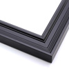 This matte black, ornately ridged crown moulding frame features a steep outer edge that cascades in curved steps into a flat valley. The inner lip rises again in a gentle, bevelled curve.
1.7 " width: ideal for medium size artworks. Select a bold painting or giclee print that can compete with this busy frame, or a strong photograph for a more modern take on this classic style.