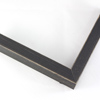 This simple, flat faced frame features rustic wood lightly coated in charcoal grey/black paint. The top coat is rubbed away in places to reveal the natural wood color below, for a soft, antiqued look.
3/4 " wide: ideal for small and medium-size images. Whether photography or paintings, rural scenes and simple images will look striking in this frame.