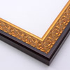 An ornate, solid wood frame featuring an intricate design overlaid with elegant gold leaf, and lightly antiqued. A shallow scooped profile and unadorned inner edge draw the eye inward. A dark brown outer edge highlights the design.
1.75 " width: ideal for medium-sized artworks. Oil paintings, prints and formal family photos will be equally at home encased in this traditional frame.