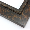 This flat profile, solid wood frame features a scroll and dot relief design along the inner edge. The entire frame is a matte black with copper touches.
2.5 " width: ideal for medium to extra large images. Highlight a traditional black and white photograph, oil painting or Giclée print. The extension of the flat outer edge beyond the relief detail ensures the frame will not detract from your image.