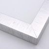 This high shine, silver foil frame features a thick, smooth profile. A brushed finish reveals subtle lines and faint black spattering gives an antique look - simple, yet glamorous. The .75 " drop between the glass and the face creates a striking, shadowed effect.
1.5 " width: ideal for medium- to large-size images. Select an oil or watercolour painting, print, or abstract photograph.