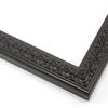 This slim, ornamented design features bevelled inner and outer edges and a celtic cross pattern in relief. The solid wood frame is covered in a matte black, while a subtle red patina gives it an antiqued look.
1.25 " width: ideal for smaller artwork. Photographs, paintings and giclee prints will shine within this detailed frame.
