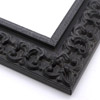 This ornate, intricate frame features a bold relief design in a dusty antiqued black. The face matched the roughly textured, raised inner lip as well.
2.75 " width: ideal for large images. Select a strong piece of artwork to avoid it being overpowered by this decadent frame.