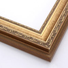 This highly detailed, solid wood frame features three distinct designs. The dominant design tops a deep scoop of smooth, brushed gold foil and meets a small detail on the inner lip. A drop ledge on the outer edge is decorated in a simple dash. Matte areas within the designs create an antiqued look.
2 " width: ideal for medium- to large-size images. The detailed nature of this frame makes it suitable for bright or busy paintings or photographs. It may overpower simpler images.