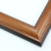 This simple, reverse curve frame features a red-brown wash with a alight sheen, that highlights the natural wood grain. The subtly bevelled inner and outer edges are matte black.
1.75 " width: ideal for small or medium size images. The plain, natural appearance of this frame makes it a great border for almost any artwork: photograph, painting or giclee print.