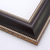 This striking, reverse scoop profile frame features a matte, deep brown face with silver foil beading on the inner and outer edges. The drop edge of the inner lip is a subtle gold foil. Solid wood.
2.125 " width: ideal for medium and large images. Add some elegance to a family portrait, or border an old oil painting or Giclée print with this simple, fashionable frame.