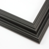 This solid wood, matte black frame features a reverse scoop profile. The inner lip recedes in a series of curved steps into a steep dip and a raised outer edge.
1.75 " width: ideal for medium size images. A wide variety of photographs, paintings and prints will be enhanced within this unique frame.