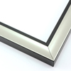 This simple, bold frame features scoop profile and silver foil face. The inner lip is stepped down and painted a matte black, to match the outer drop edge.
1.25 " width: ideal for small or medium size artworks. Due to it