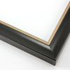 This simple, bold frame features scoop profile and matte black face with subtle crosshatching. The inner lip is stepped down and covered in distressed bronze foil.
1.25 " width: ideal for small or medium size artworks. Due to it