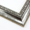 This classic, Victorian-style frame features a solid wood, reverse scoop profile. The relief-detailed inner lip and sloped face are a textured silver foil, edged in a subtle bevel.
2 " width: ideal for medium size images. Border an acrylic or oil painting or print with this antiqued, high fashion frame.